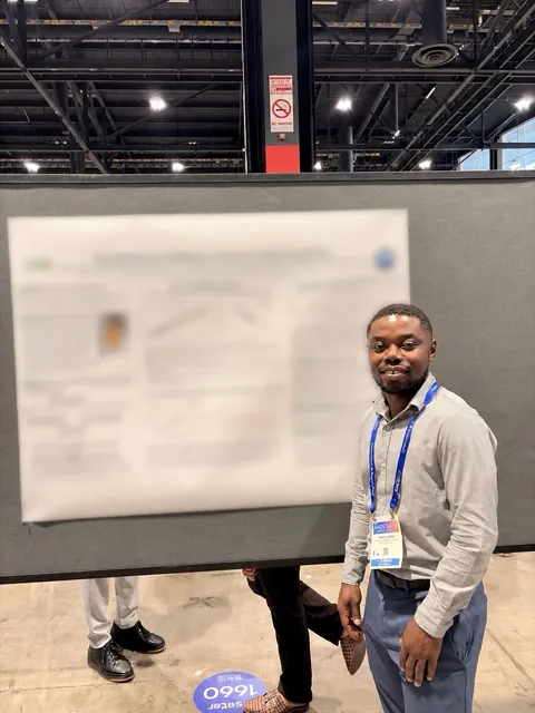 Prince presenting his poster at the ACS Fall meeting in Chicago